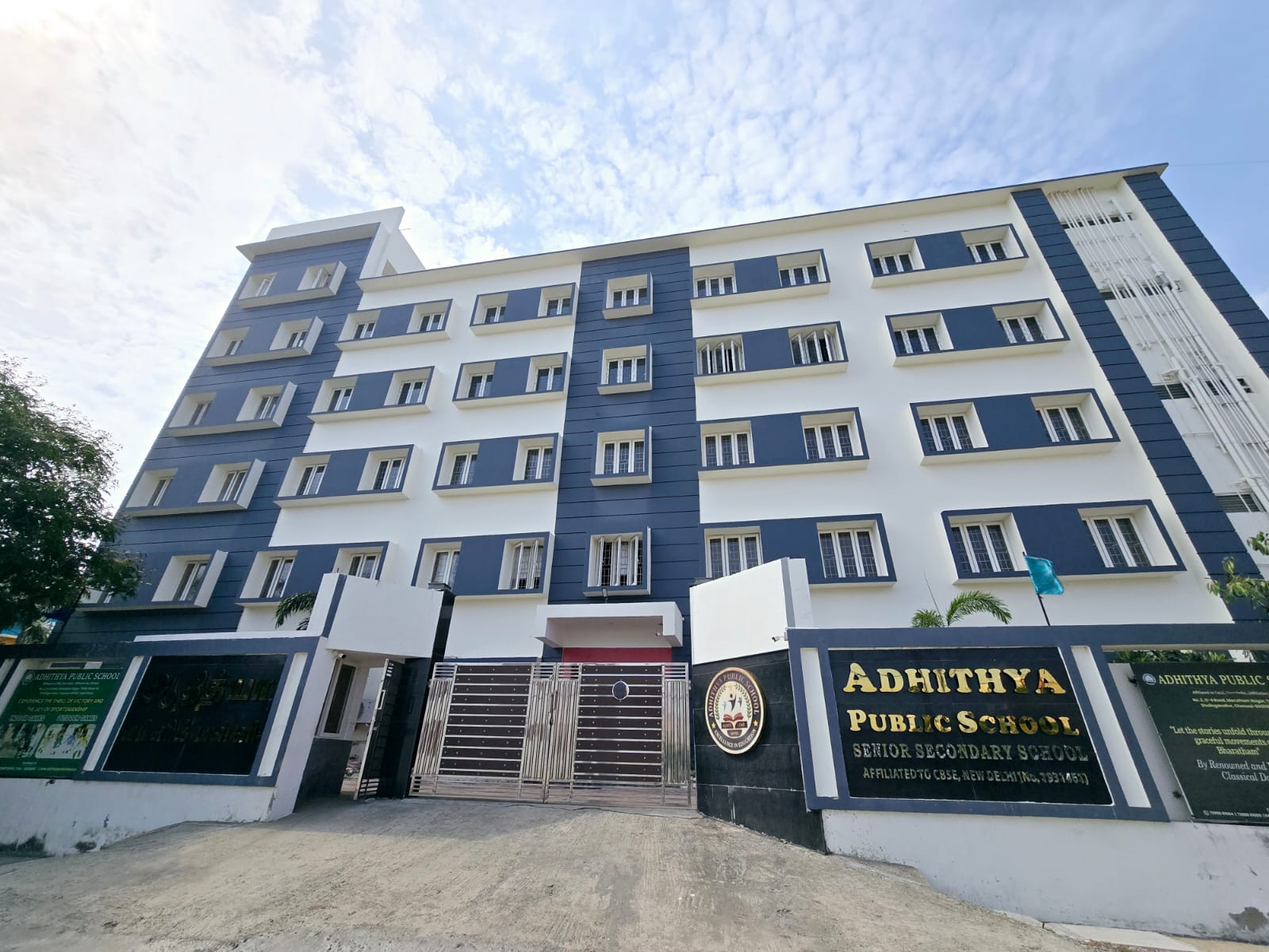 Worker painting exterior surface — School Exterior Repaint Sholinganallur